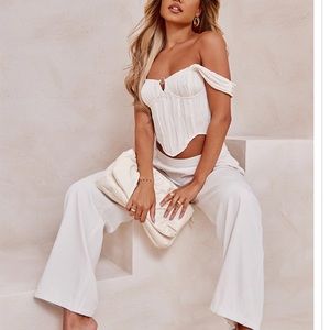 Cute Top: Off white corset with ring embellishment